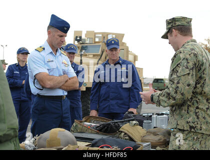 VIRGINIA BEACH, Va. (Nov. 15, 2013) – Capt. Brian Thompson, U.S. Coast Guard Maritime Security Response Team (MSRT), discusses conventional and special operations equipment with Lt. Daniel Kenyon, assigned to Explosive Ordnance Disposal Group (EODGRU) 2, during a visit to Navy Expeditionary Combat Command (NECC) at Joint Expeditionary Base Little Creek-Fort Story. Thompson visited NECC to get an overview of NECC commands and discuss expeditionary capabilities. NECC serves as the single functional command in control of manning, training, equipping and organizing Navy expeditionary forces. (U.S. Stock Photo