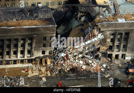 010914-F-8006R-001  This aerial photograph shot on Sept. 14, 2001, shows some of the destruction caused when the high-jacked American Airlines flight slammed into the Pentagon on Sept. 11.  The terrorist attack caused extensive damage to the west face of the building and followed similar attacks on the twin towers of the World Trade Center in New York City.   DoD photograph by Tech. Sgt. Cedric H. Rudisill.  (Released) US Navy 010914-F-8006R-001 aerial view of Pentagon destruction Stock Photo