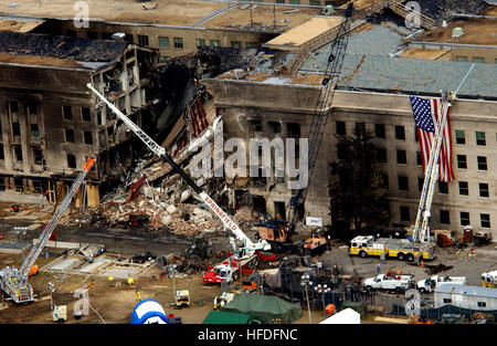 010914-F-8006R-003 Arlington, Va. (Sep. 14, 2001) -- Aerial view of the destruction caused when a high-jacked commercial jet crashed into the Pentagon on Sep. 11th.  The terrorist attack caused extensive damage to the Pentagon.  American Airlines FLT 77 was bound for Los Angeles from Washington Dulles with 58 passengers and 6 crew.  All aboard the aircraft were killed, along with 125 people in the Pentagon. U.S. Navy Photo Courtesy of DoD Photographer Tech. Sgt. Cedric H. Rudisill (RELEASED) US Navy 010914-F-8006R-003 Aerial view of Pentagon destruction Stock Photo