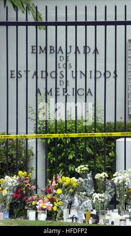 Mourners place flowers and candles outside the American Embassy in ...