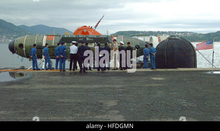 020423-N-0401E-001 Sasebo, Japan (Apr. 23, 2002) Ð A naval officer assigned to the U.S. Navy Los Angeles class attack submarine USS La Jolla (SSN 701), explains the capabilities of the deep submergence rescue vehicle Mystic (DSRV-1), to naval officers from the Japanese Maritime Self Defense Force.  La Jolla and Mystic will operate with surface ships and submarines from the U.S., Japan, Australia, the Republic of Korea and the Republic of Singapore during Exercise Pacific Reach.  Mystic was specifically designed to fill the need for an improved means of rescuing the crew of a submarine immobili Stock Photo