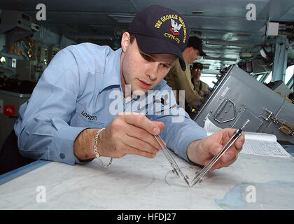 020909-N-3986D-002 At sea aboard USS George Washington (CVN 73) Sep. 9, 2002 -- Quartermaster 3rd Class Chad Lopresti from Lorain, Ohio, plots the current position of the Washington while underway.  Washington is on a six-month deployment conducting combat missions in support of Operation Enduring Freedom and Operation Southern Watch.  U.S. Navy photo by Photographer's Mate Airman Jessica Davis.  (RELEASED) US Navy 020909-N-3986D-002 plotting the current position of USS Washington Stock Photo