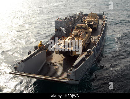 081018-N-9134V-082 PERSIAN GULF (Oct. 18, 2008) A landing craft utility assigned to Assault Craft Unit (ACU) 4 disembarks from the amphibious dock landing ship USS Carter Hall (LSD 50) to conduct amphibious operations. Carter Hall is deployed as part of the Iwo Jima Expeditionary Strike Group supporting maritime security operations in the U.S. 5th Fleet area of responsibility. (U.S. Navy photo by Mass Communication Specialist 2nd Class Flordeliz Valerio/Released) 081018-N-9134V-082 Stock Photo