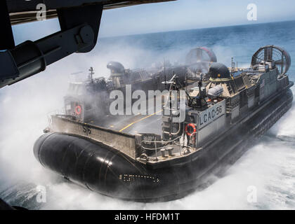 CAMP PENDLETON (July 20, 2016) A landing craft air cushion (LCAC) vehicle prepares to enter the well deck of the amphibious transport dock ship USS Somerset (LPD 25) during a well deck onload operation as part of PHIBRON-MEU Integrated Training (PMINT), a scenario-based amphibious integration exercise with Amphibious Squadron Five and the 11th Marine Expeditionary Unit as part of the Makin Island Amphibious Ready Group (MKIARG). (U.S. Navy photo by Mass Communication Specialist 1st Class Vladimir Ramos/Released) 160720-N-CC789-075 Join the conversation: http://www.navy.mil/viewGallery.asp http Stock Photo