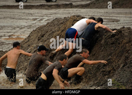 Participants Transit An Obstacle During The 14th Annual Seabee Volkslauf Mud Run At Naval Construction Battalion Center Gulfport Miss Sept 12 2009 More Than 400 Participants Took Part In The Four Mile Run