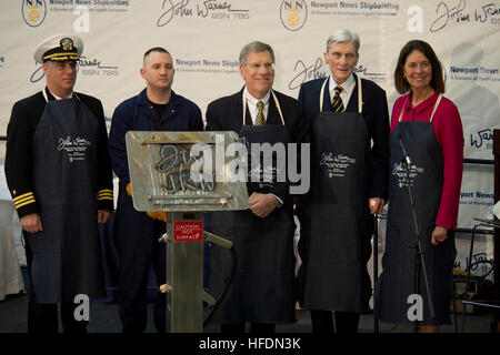 NEWPORT NEWS, Va. (March 16, 2013) Vice Adm. Michael Connor, commander, Submarine Forces, Mathew Shilling, a Newport News Shipbuilding employee, Matt Mulherin, President of Newport News Shipbuilding, former Sen. John Warner and his wife Jeanne Warner stand behind a welded steel plate bearing the initials of the submarine's namesake and sponsor during the keel laying ceremony for the Virginia-class attack submarine Pre-Commissioning Unit (PCU) John Warner (SSN 785). John Warner is the 12th Virginia-class attack submarine and the sixth to be delivered to the U.S. Navy by Newport News Shipbuildin