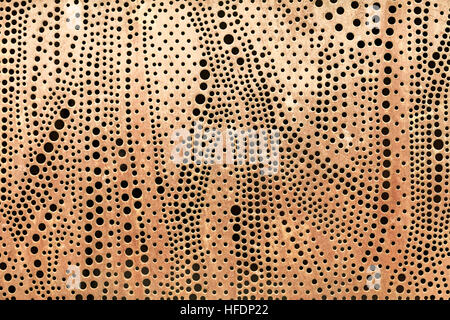 Perforated metal sheet abstract background. Stock Photo