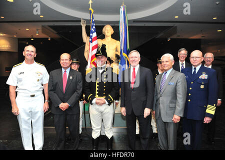 WASHINGTON, DC- Coast Guard Commandant Adm Bob Papp, Secretary of the Navy Ray Mabus, and Vice Chief of Naval Operations Adm. Jonathan Greenert, pose for a picture with attendees at a ceremony announcing a partnership between the U.S. Navy and Operation Sail for the bicentennial commemoration of the War of 1812 and the writing of the 'Star-Spangled Banner' at the Smithsonian's Museum of American History. The museum houses the Star-Spangled Banner, the actual flag that inspired Francis Scott Key during the battle of Baltimore in 1814. U.S. Navy photo by Mass Communication Specialist 2nd Class G Stock Photo