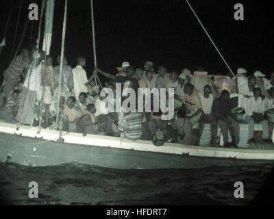 050430-C-0279E-001 Windward Pass (April 30, 2005) - Haitian migrants wait to be evacuated from a 50- foot sailboat by U.S. Coast Guardsmen in the Windward Pass.  The U.S. Coast Guard Cutter Dependable (WMEC 626) intercepted the vessel, removed 132 migrants, and repatriated them back to Haiti.  U.S. Coast Guard photo by Public Affairs Specialist 2nd Class John Edwards (RELEASED) Boat People from Haiti Stock Photo