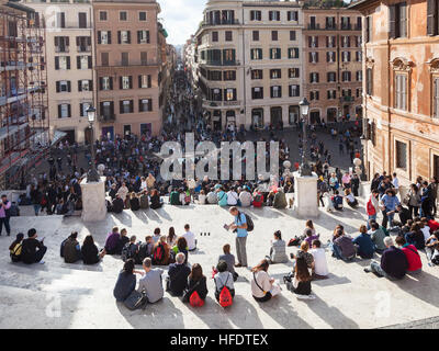 ROME, ITALY - NOVEMBER 1, 2016: tourist on Spanish Steps in Rome city. Spanish Steps are stairway in Rome, climbing a steep slope between the Piazza d Stock Photo