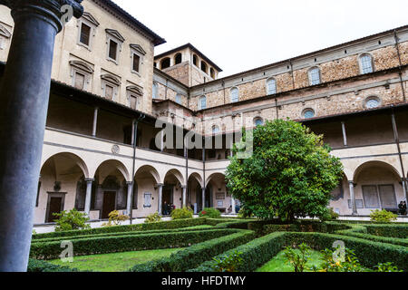 FLORENCE, ITALY - NOVEMBER 6, 2016: patio of Basilica di San Lorenzo (Basilica of St Lawrence) in rain. The Church is the burial place of all the prin Stock Photo