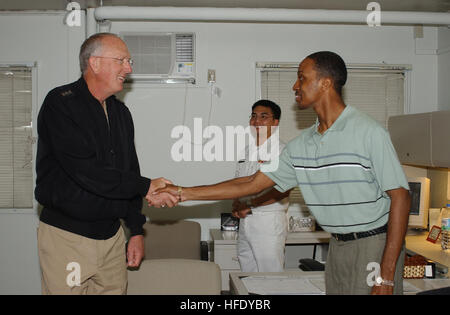 040504-N-0435H-021 Naval Air Facility Atsugi, Japan (May 4, 2004) - Vice Adm. Michael L. Cowan, Surgeon General of the Navy and Chief, Bureau of Medicine and Surgery, visits the Branch Medical and Dental Clinics aboard Naval Air Facility Atsugi and meets with Tricare representative Jerry Davis. Visiting the Medical and Dental Clinics is one way Vice Adm. Cowan can ensure quality health delivery to all service members and their families. U.S. Navy photo by Photographer's Mate 2nd Class Tracy Hull. (RELEASED) US Navy 040504-N-0435H-021 Vice Adm. Michael L. Cowan, Surgeon General of the Navy and  Stock Photo