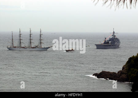 040514-N-1194D-014 Shimoda, Japan (May 14, 2004) - The Japanese tall ship Nippon Maru and the U.S. NavyÕs command ship USS Coronado (AGF 11) anchor just outside Shimoda during the 65th Shimoda Black Ship Festival. The Seventh Fleet amphibious command ship Coronado steamed from itÕs forward deployed location in Yokosuka, Japan, for the three-day celebration. The festival promotes the theme of peaceful relations between the Japanese and American people, and commemorates the 1854 landing of Commodore Matthew Perry and the signing of the Japanese-American treaty of trade and amity at Shimoda. This Stock Photo