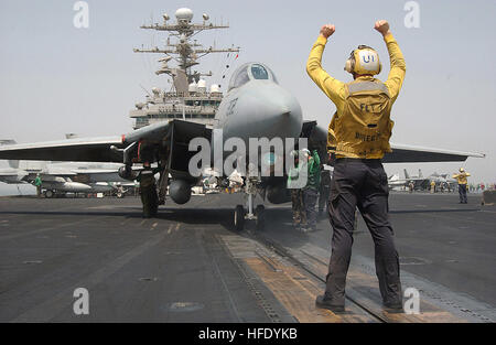 040515-N-1045B-015 Arabian Gulf (May 15, 2004) - Aviation Boatswain's Mate Airman Ronald Marinello, of Philadelphia, Pa., directs an F-14B Tomcat assigned to the 'Red Rippers' of Fighter Squadron One One (VF-11) onto one of the four steam-powered catapults aboard USS George Washington (CVN 73). The Norfolk, Va.-based aircraft carrier and embarked Carrier Air Wing Seven (CVW-7) are on a scheduled deployment in support of Operation Iraqi Freedom (OIF). U.S. Navy photo by Photographer's Mate Airman Michael D. Blackwell II. (RELEASED) US Navy 040515-N-1045B-015 Aviation Boatswain's Mate Airman Ron Stock Photo