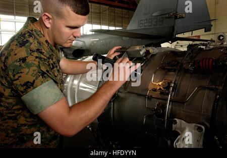 040525-N-6436W-009 Naval Air Station Whidbey Island, Wash. (May 25, 2004) - U.S. Marine Corps Staff Sgt. Jeremy Ficklin inspects an EA-6B Prowler Pratt & Whitney J52-P-408 turbojet engine. Ficklin is the Quality Assurance Center Supervisor assigned to the 'Vikings' of Electronic Attack Squadron One Two Nine (VAQ-129) and has been selected as a candidate for the Marine of the Year Award. U.S. Navy photo by Photographer's Mate 2nd Class Michael B. W. Watkins (RELEASED) US Navy 040525-N-6436W-009 U.S. Marine Corps Staff Sgt. Jeremy Ficklin inspects an EA-6B Prowler Pratt %%5E Whitney J52-P-408 tu Stock Photo