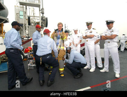 040528-N-8933S-019 New York City, N.Y. (May 28, 2004) - Steve Doocy of Fox News, dons a Navy Fire Fighting Ensemble with the help of Damage Controlmen assigned to the amphibious assault ship USS Iwo Jima (LHD 7) during the popular Fox morning show, Fox and Friends. Doocy interviewed and demonstrated various equipment found on the ship during the 17th Annual Fleet Week held in New York City. Over 4,000 Sailors, Marines and Coast Guardsmen on 12 ships participated in this year's Fleet Week from May 26 to June 2. U.S. Navy photo by Photographer's Mate 2nd Class R.J. Stratchko (RELEASED) US Navy 0