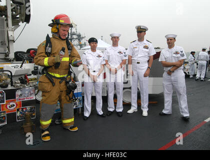 040528-N-8933S-022 New York City, N.Y. (May 28, 2004) - Steve Doocy of Fox News, demonstrates a U.S. Navy Fire Fighting Ensemble with Damage Controlmen assigned to the amphibious assault ship USS Iwo Jima (LHD 7) during the popular Fox morning show, Fox and Friends. Doocy interviewed and demonstrated various equipment found on the ship during the 17th Annual Fleet Week held in New York City. Over 4,000 Sailors, Marines and Coast Guardsmen on 12 ships participated in this year's Fleet Week from May 26 to June 2. U.S. Navy photo by Photographer's Mate 2nd Class R.J. Stratchko (RELEASED) US Navy 
