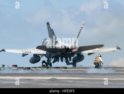 040609-N-7408M-054 Atlantic Ocean (June 9, 2004) - An F/A-18 Hornet assigned to the ÒSidewindersÓ from Fighter Attack Squadron Eight Six (VFA-86), launches from USS Enterprise (CV 65). Enterprise is one of seven aircraft carriers involved in Summer Pulse 2004. Summer Pulse 2004 is the simultaneous deployment of seven aircraft carrier strike groups (CSGs), demonstrating the ability of the Navy to provide credible combat power across the globe, in five theaters with other U.S., allied, and coalition military forces. Summer Pulse is the NavyÕs first deployment under its new Fleet Readiness Plan ( Stock Photo