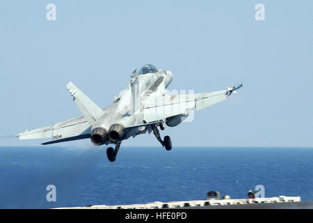 040613-N-4757S-310 Atlantic Ocean (June 13, 2004) - An F/A-18C Hornet assigned to the 'Raging Bulls' of Fighter Attack Squadron Three Seven (VFA-37) launches from the flight deck of USS Harry S. Truman (CVN 75). Truman is one of seven aircraft carriers involved in Summer Pulse 2004. Summer Pulse 2004 is the simultaneous deployment of seven aircraft carrier strike groups (CSGs), demonstrating the ability of the Navy to provide credible combat power across the globe, in five theaters with other U.S., allied, and coalition military forces. Summer Pulse is the NavyÕs first deployment under its new Stock Photo