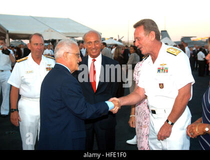 040628-N-2591H-001 Grand Harbor, Malta (June 28, 2004) Ð Commander Six Fleet, Vice Admiral Henry G. Ulrich III greets Maltese President, Edward Fenech-Adami aboard the conventionally powered aircraft carrier USS John F. Kennedy (CV 67) during a Sunset Parade on the shipÕs flight deck. Kennedy is one of seven aircraft carriers participating in Summer Pulse 2004. Summer Pulse 2004 is the simultaneous deployment of seven aircraft carrier strike groups (CSGs), demonstrating the ability of the Navy to provide credible combat power across the globe, in five theaters with other U.S., allied, and coal Stock Photo