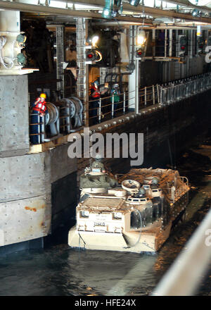 040712-N-0938S-002  Atlantic Ocean (July 12, 2004) - An amphibious assault vehicle (AAV) waits for the signal to depart the amphibious assault ship USS Saipan (LHA 2) during an amphibious landing exercise. The AAV is an armored assault amphibious full-tracked landing vehicle. The vehicle carries troops in water operations from ship to shore, through rough water and surf zone. It also carries troops to inland objectives once ashore. Saipan is at sea conducting training exercises for a scheduled deployment. U.S. Navy photo by Photographer's Mate Airman Apprentice Erik K. Siegel (RELEASED) US Nav Stock Photo