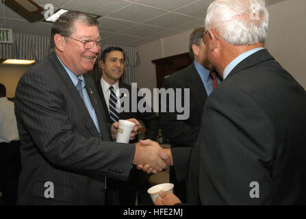 040723-N-2636M-005  San Diego, Calif. (July 23, 2004) - Rep. Randy “Duke” Cunningham (R-San Diego) and other distinguished visitors gather to receive instructions and before boarding an SH-60 Seahawk helicopter bound for USS Ronald Reagan (CVN 76). Distinguished visitors flew aboard Reagan to welcome the ship’s crew to Naval Air Station North Island, San Diego, Calif. Homeporting ceremonies for the Navy’s newest and most technologically advanced aircraft carrier will host various dignitaries, including Nancy Reagan, members of the Congress, state officials and various celebrities. Reagan is co Stock Photo