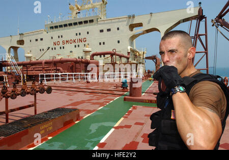 040730-G-1034C-109 Arabian Gulf (July 30, 2004) Ð A boarding team member aboard the U.S. Coast Guard Cutter Adak (WPB 1333), GunnerÕs Mate 2nd Class David Turner takes a quick drink of water while on board an oil tanker. Adak is patrolling the Northern Arabian Gulf along with other Coast Guard, U.S. Navy and coalition warships as part of Operation Iraqi Freedom (OIF). U.S. Coast Guard photo by Public Affairs 2nd Class Zachary A. Crawford (RELEASED) US Navy 040730-G-1034C-109 A boarding team member aboard the U.S. Coast Guard Cutter Adak (WPB 1333), Gunner%%5Ersquo,s Mate 2nd Class David Turner Stock Photo