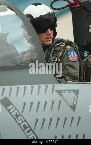 An F-14 Tomcat pilot of Fighter Squadron 102 (VF-102) waits in the