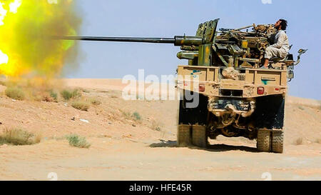 Still image taken from an ISIS propaganda video showing a technical vehicle outfitted with artillery canon operated by Islamic State militants during battles against the Syrian Army June 28, 2016 in Deir ez-Zor province, Syria. Stock Photo