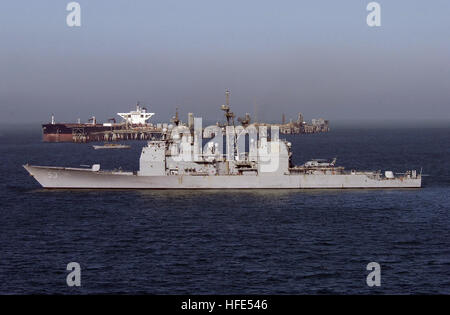 041020-N-1348L-170 North Arabian Gulf - (Oct. 20, 2004) - The guided missile cruiser USS Mobile Bay (CG 53) and Landing Craft Utility (LCU 1634), assigned to Assault Craft Unit Five (ACU-5), patrol the waters surrounding the Al Basrah Oil Terminal (ABOT) as a super tanker takes-on crude oil. Mobile Bay and LCU 1634 are among several U.S. Navy, Coast Guard and coalition ships that share the responsibilities of patrolling and safeguarding the waters near the Khawr AL Amaya Oil Terminal (KAAOT) and the Al Basrah Oil Terminal (ABOT) in the Arabian Gulf. U.S. Navy photo by Photographer's Mate 1st C Stock Photo