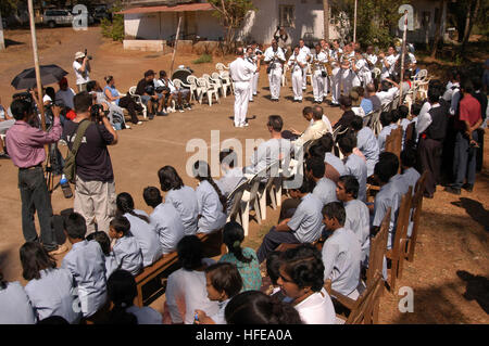 050216-N-1194D-001 Goa, India (Feb. 16, 2005) - The Seventh Fleet Band plays for the children of the Saint Francis Xavier Academy for Children with Special Needs in Goa, India, during a community service project. More than 40 Sailors assigned to the command ship USS Blue Ridge (LCC 19) and the embarked Seventh Fleet staff also participated in the project by refurbishing part of the schoolÕs multi-purpose facility during the shipÕs port visit Feb. 15-18, 2005. U.S. Navy photo by Journalist 2nd Class Patrick Dille (RELEASED) US Navy 050216-N-1194D-001 The Seventh Fleet Band plays for the childre Stock Photo