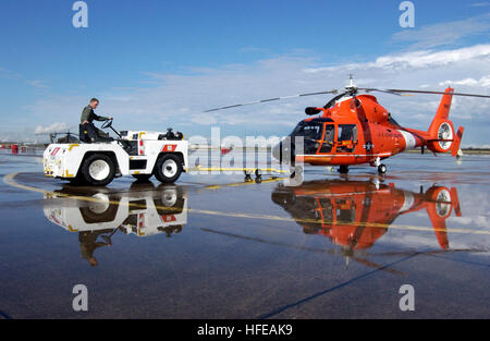 050307-C-0379W-012 Houston, Texas (Mar. 7, 2005) - A member of Coast Guard Air Station Houston, Texas, maneuvers an HH-65B Dolphin rescue helicopter in position after a hard rain. Coast Guard Air Station Houston responds to more than 200 search and rescue missions every year. U.S. Coast Guard photo by Chief Warrant Officer Adam Wine (RELEASED) US Navy 050307-C-0379W-012 A member of Coast Guard Air Station Houston, Texas, maneuvers an HH-65B Dolphin rescue helicopter in position after a hard rain Stock Photo