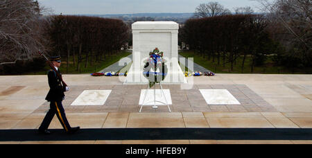 050324-N-0295M-244 Arlington, Va. (Mar. 24, 2005) Ð Tomb Guard Pfc. Michael Steiner marches 21 steps down the black mat behind the Tomb of the Unknowns at Arlington National Cemetery, Va. Twenty-one steps was chosen because it symbolizes the highest military honor that can be bestowed, the 21-gun salute. The Tomb of the Unknowns is guarded 24 hours a day, 365 days a year, and in any weather by Tomb Guard sentinels. The sentinels, all volunteers, are considered to be the best of the 3rd U.S. Infantry (The Old Guard), headquartered at Fort Myer, Va. U.S. Navy photo by PhotographerÕs Mate 2nd Cla Stock Photo