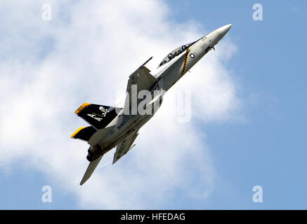 050521-N-0295M-057  Andrews Air Force Base, Md. (May 21, 2005) - An F/A-18F Super Hornet, assigned to the 'Jolly Rogers' of Strike Fighter Squadron One Zero Three (VFA-103), flown by aircrew assigned to the 'Gladiators' of Strike Fighter Squadron One Zero Six (VFA-106), trails vapor from its leading edge extensions as it conducts a maneuver during its flight demonstration at the 2005 Joint Service Open House. The Joint Services Open House, held May 20-22, showcased civilian and military aircraft from the Nation's armed forces, which provided many flight demonstrations and static displays. U.S. Stock Photo