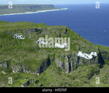 030116-F-3488S-058 Andersen Air Force Base, Guam (Jan. 16, 2003) -- Two UH-46 ÒSea KnightsÓ and three UH-60 ÒBlack HawksÓ fly over the northern tip of Guam as part of a six-helicopter formation during flight training.  The helicopters are assigned to the ÒChargersÓ of Helicopter Combat Support Squadron Five (HC-5) stationed at Andersen.  The ÒChargersÓ primary mission is re-supplying combatant ships at sea by vertical replenishment.  U.S. Air Force photo by Airman 1st Class Joshua P. Strang.  (RELEASED) US Navy 030116-F-3488S-058 Two UH-46 %%5Eldquo,Sea Knights%%5Erdquo, and three UH-60 %%5Eld Stock Photo