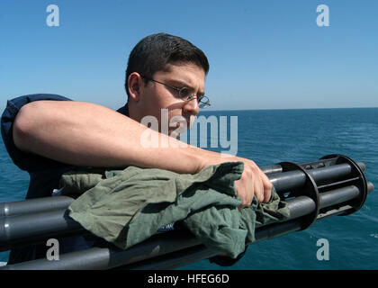 030302-N-2972R-077 Arabian Gulf (Mar. 2, 2003) -- Fire Controlman 3rd Class Adrian Herevia conducts preventative maintenance and corrosion inspection on the gun barrel for a Close In Weapons System (CIWS) aboard the assault ship USS Kearsarge (LHD 3). Kearsarge is currently deployed as the flagship of Amphibious Task Force East (ATF-E) in support of Operation Enduring Freedom. U.S. Navy photo by Photographer's Mate 3rd Class Angel Roman-Otero.  (RELEASED) US Navy 030302-N-2972R-077 CIWS Preventative Maintenance at sea Stock Photo