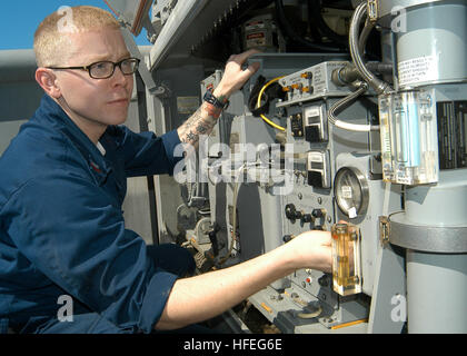 030302-N-2972R-086 Arabian Gulf (Mar. 2, 2003) -- Fire Controlman 2nd Class Brian Gadeberg performs periodic maintenance on Close In Weapons System (CIWS) aboard the amphibious assault ship USS Kearsarge (LHD 3). Kearsarge is currently deployed as the flagship of Amphibious Task Force East (ATF-E) in support of Operation Enduring Freedom. U.S. Navy photo by Photographer's Mate 3rd Class Angel Roman-Otero.  (RELEASED) US Navy 030302-N-2972R-086 CIWS Preventative Maintenance at sea Stock Photo