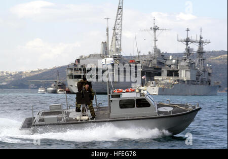 030303-G-3024G-003   Souda Bay, Crete, Greece (Mar. 3, 2003) -- A 27-foot patrol boat assigned to U.S . Naval Coastal Warfare Group Two watches over vessels in the anchorage area in Souda Bay.    U.S. Coast Guard photo by Public Affairs Specialist First Class John Gaffney.  (RELEASED) US Navy 030303-G-3024G-003 A 27-foot patrol boat assigned to U.S . Naval Coastal Warfare Group Two watches over vessels in the anchorage area in Souda Bay Stock Photo