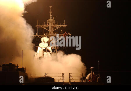 030320-N-6141B-003 The Red Sea  (Mar. 20, 2003) -- Tomahawk Land Attack Missiles (TLAM) launch from the shipÕs forward and aft MK-41 vertical launch systems (VLS) aboard the guided missile destroyer USS Donald Cook (DDG 75).  The cruise missiles were among the first to be fired in support of Operation Iraq Freedom. U.S. Navy photo by Chief Journalist Alan J. Baribeau.  (RELEASED) US Navy 030320-N-6141B-003 Tomahawk Land Attack Missiles (TLAM) launch from the ship%%5Ersquo,s forward and aft MK-41 vertical launch systems (VLS) aboard the guided missile destroyer USS Donald Cook (DDG 75) Stock Photo