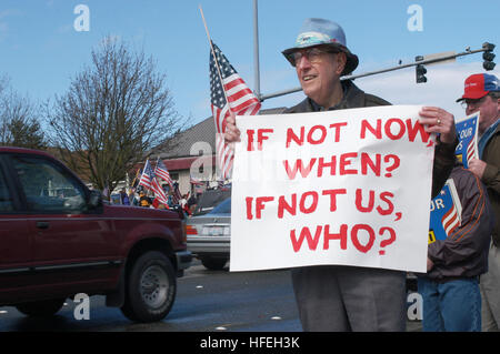 030322-N-6477M-003   Bellevue, Wash. (Mar. 22, 2003) -- Local residents take part in a troop support rally in Bellevue hosted by Operation Support Our Troops. The mission of Operation Support Our Troops is to provide a process and forum for Americans of diverse interests, backgrounds and walks of life to come together to demonstrate to members of the Armed Forces and their Commander in Chief that they are supported and deeply appreciated for their service. The goal is to ensure that they know that United We Stand and Divided We Fall are not empty words, but words to which we subscribe.  Accord Stock Photo