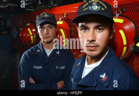 040421-N-5862D-068  Naval Station Ingleside, Texas (Apr. 21, 2003) -- Engineman 2nd Class Nick Urena (right), from Brooklyn, N.Y. and Boatswain's Mate 3rd Class Christina Sebren, from Galveston, Texas, are both stationed aboard the Osprey class Coastal Mine Hunter USS Kingfisher (MHC 56). The Osprey Class ships are mine hunter-killers capable of finding, classifying and destroying moored and bottom floor mines.  U.S. Navy Photo by Chief Photographer's Mate Chris Desmond.  (RELEASED) US Navy 030421-N-5862D-068 Engineman 2nd Class Nick Urena (right), from Brooklyn, N.Y. and Boatswain's Mate 3rd  Stock Photo