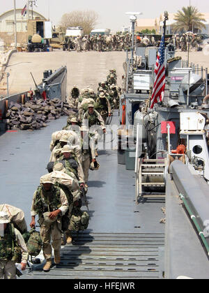 030425-N-1050K-016  Camp Patriot, Kuwait (Apr. 25, 2003) -- More than 2,200 Marines assigned to the 24th Marine Expeditionary Unit, Special Operations Capable (24th MEU (SOC)) begin their journey home while boarding a Landing Craft Utility (LCU) - making them the first Marine force to depart Iraq after the commencement of Operation Iraqi Freedom.  The 24th MEU embarked aboard the amphibious assault ship USS Nassau (LHA 4) deployed in August 2002, and received orders to support Operation Iraqi Freedom in March.  The 24th MEU is a special operations capable rapid response force that is typically Stock Photo