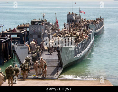 030425-N-1050K-030  Camp Patriot, Kuwait (Apr. 25, 2003) -- More than 2,200 Marines assigned to the 24th Marine Expeditionary Unit, Special Operations Capable (24th MEU (SOC)) begin their journey home while boarding a Landing Craft Utility (LCU) - making them the first Marine force to depart Iraq after the commencement of Operation Iraqi Freedom.  The 24th MEU embarked aboard the amphibious assault ship USS Nassau (LHA 4) deployed in August 2002, and received orders to support Operation Iraqi Freedom in March.  The 24th MEU is a special operations capable rapid response force that is typically Stock Photo