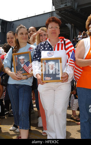 030529-N-6607P-001  Naval Station Norfolk, Va. (May 29, 2003) -- Family members of Sailors aboard the USS Theodore Roosevelt (CVN 71) anxiously await the return of their loved ones.  The Roosevelt is returning from deployment in support of Operations Enduring and Iraqi Freedom.  U.S. Navy photo by Photographer's Mate 3rd Class Delia Pettit.  (RELEASED) US Navy 030529-N-6607P-001 Family members of Sailors aboard the USS Theodore Roosevelt (CVN 71) anxiously await the return of their loved ones Stock Photo