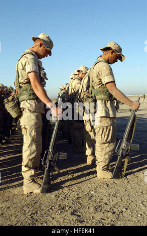 030430-N-6077T-002 Camp White Horse, Iraq (Apr. 30, 2003) -- Marines assigned to 1st Battalion 10th Marines, Camp Lejeune, N.C., conducts a memorial service for Chief Warrant Officers Rob Channell and Andy Arnold who were killed in a training accident.  1st Battalion 10th Marines are currently deployed in support of Operation Iraqi Freedom. Operation Iraqi Freedom is the multi-national coalition effort to liberate the Iraqi people, eliminate Iraq's weapons of mass destruction and end the regime of Saddam Hussein.  U.S. Navy photo by Photographer's Mate 1st Class Kevin H. Tierney. (RELEASED) US Stock Photo