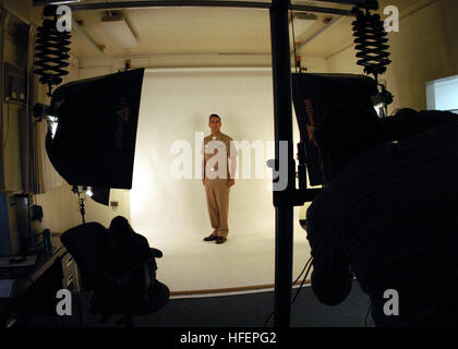 031016-N-5134H-002  Naval Air Station Whidbey Island, Wa. (Oct. 16, 2003) Ð Lt. Cmdr. Warren Clark assigned to the ÒTotemsÓ of Patrol Squadron Sixty Nine (VP-69), gets his picture taken for his service record by Photographer's Mate 2nd Class Michael Winter.   U.S. Navy photo by Photographer's Mate Casey R. Hutchens.  (RELEASED) US Navy 031016-N-5134H-002 Lt. Cmdr. Warren Clark assigned to the %%5Eldquo,Totems%%5Erdquo, of Patrol Squadron Sixty Nine (VP-69), gets his picture taken for his service record by Photographer's Mate 2nd Class Michael Winter Stock Photo