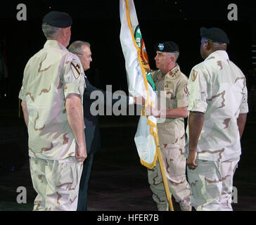 030707-N-5891B-009 Tampa, Fla. (Jul. 7, 2003) -- U.S. Army Gen. John P. Abizaid accepts the command flag from the Honorable Donald Rumsfeld, Secretary of Defense, during the U.S. Central Command (CENTCOM) change of command ceremony.  Gen. Abizaid assumed command from Gen. Tommy R. Franks who steps down after 38 years of military service.  CENTCOM covers the 25 countries of the Middle East, Central Asia, and Horn of Africa.  The area is larger than the continental United States and stretches 3,600 miles to the east and west, and 4,600 miles to the north and south.  U.S. Navy photo by Petty Offi Stock Photo