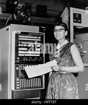 A 'female computer' refers to a term used during the early days of aerospace and scientific research to describe women who performed complex mathematical calculations for missions such as those at NASA. Stock Photo