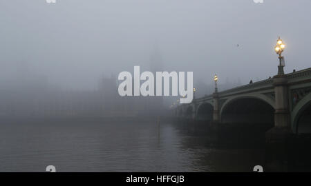 Fog shrouds the Houses of Parliament in central London after forecasters warned of visibility as low as 100 metres with fog and sub-zero temperatures across swathes of England. Stock Photo