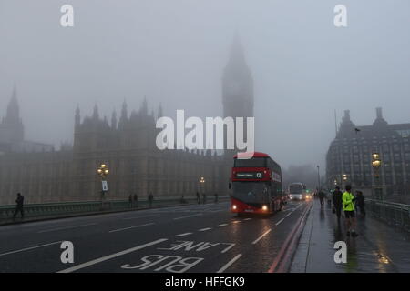 Fog shrouds the Houses of Parliament in central London after forecasters warned of visibility as low as 100 metres with fog and sub-zero temperatures across swathes of England. Stock Photo